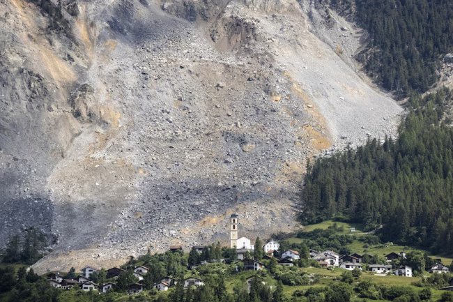 Close Call: Massive Rockslide Narrowly Misses Swiss Village